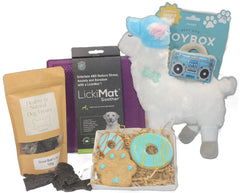 Gift for a pet lover containing a Llama stuffed squeaky toy by Fringe Studio purple Likimat hand made dog biscuits and dried beef liver organic dog treats.